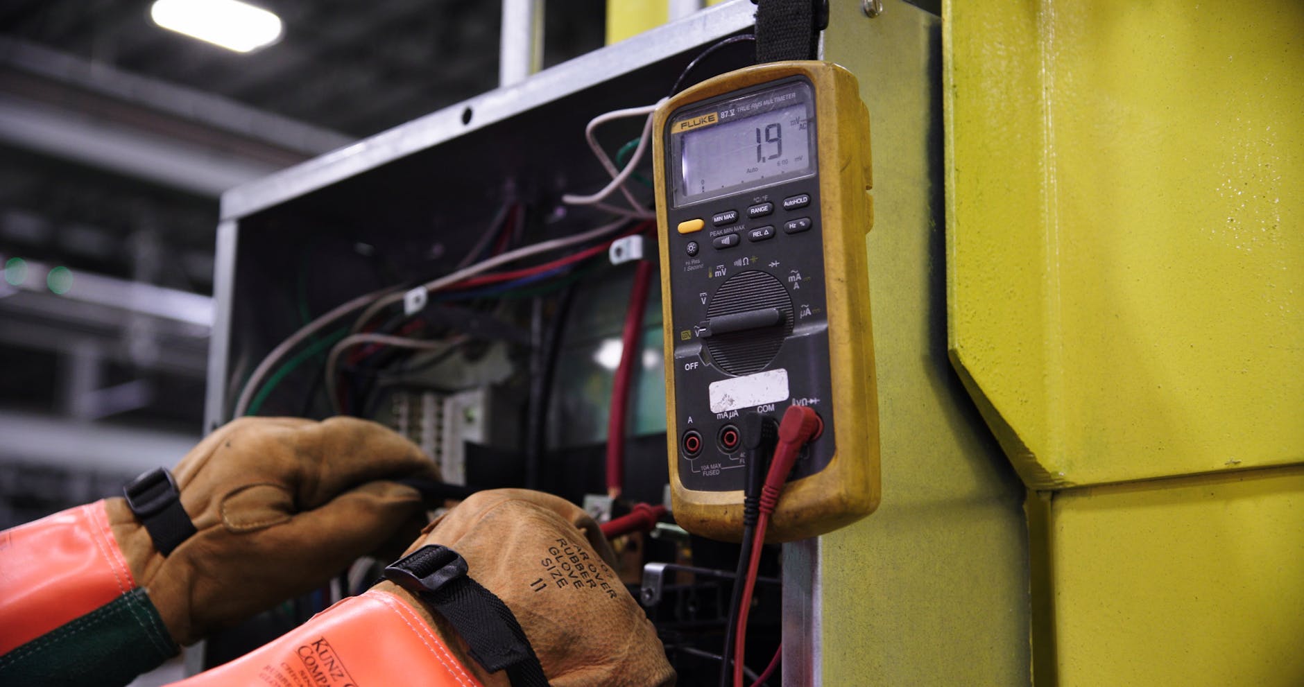 electrician checking electrical panel components