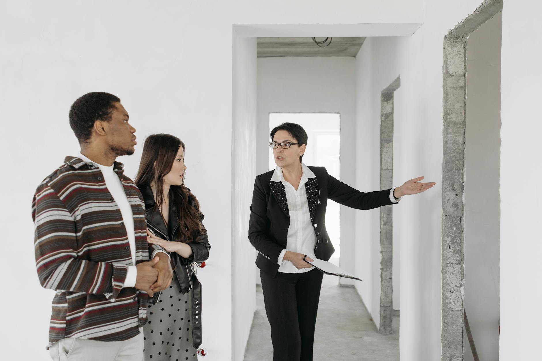 interior designer showing plans to client, modern home
