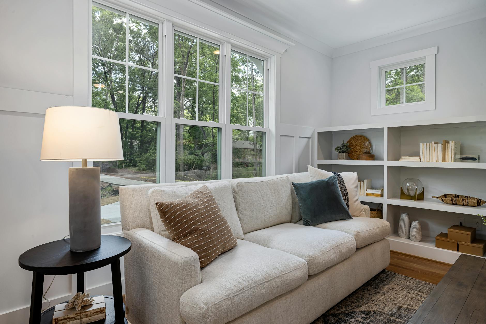 modern living room with large sofa and decorative pillows