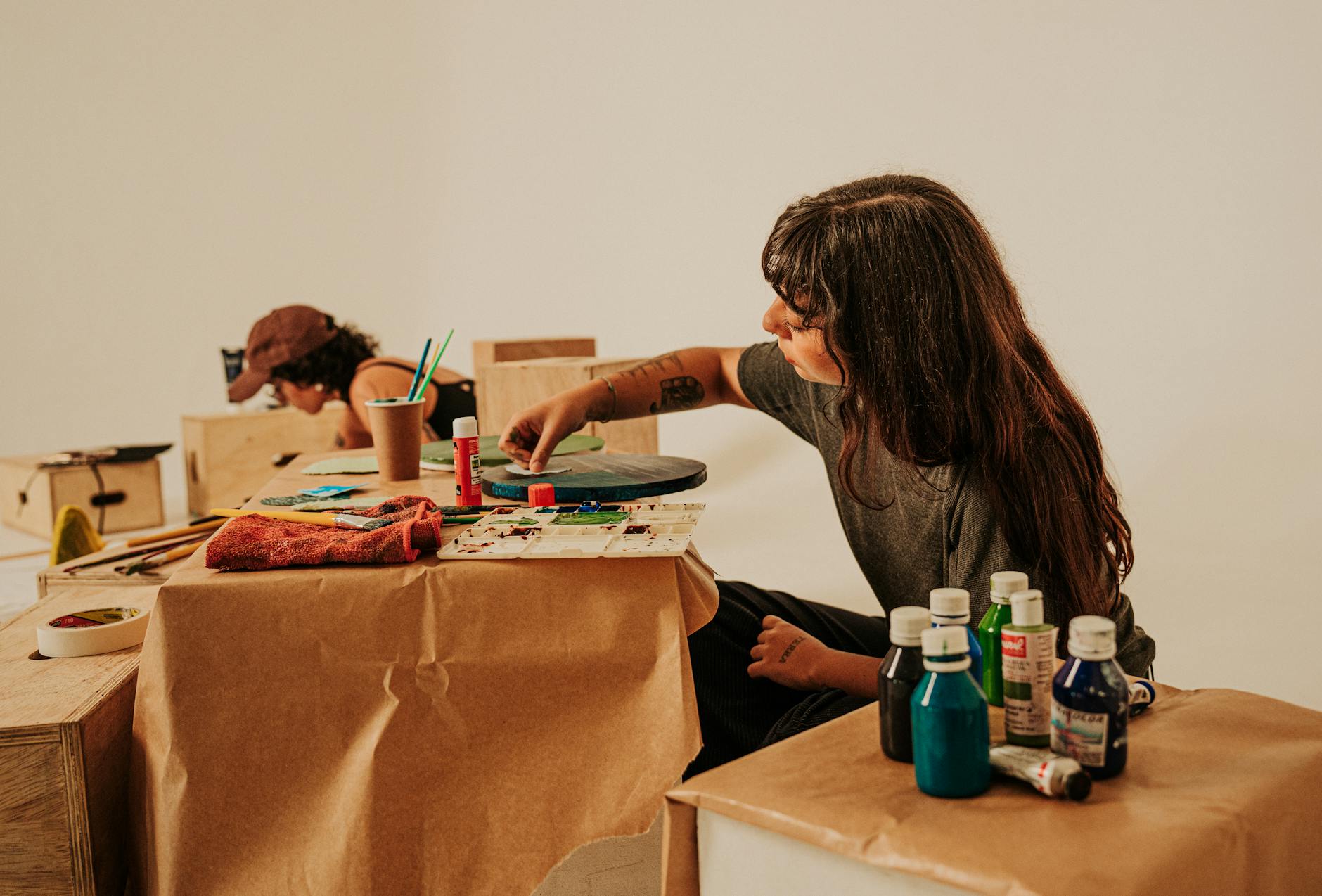 woman painting old wooden dresser