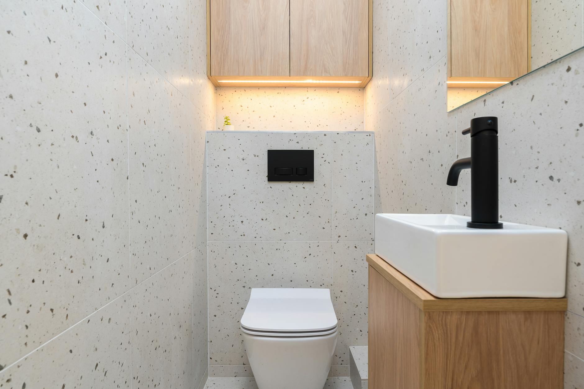 modern minimalist toilet interior white walls wood accents