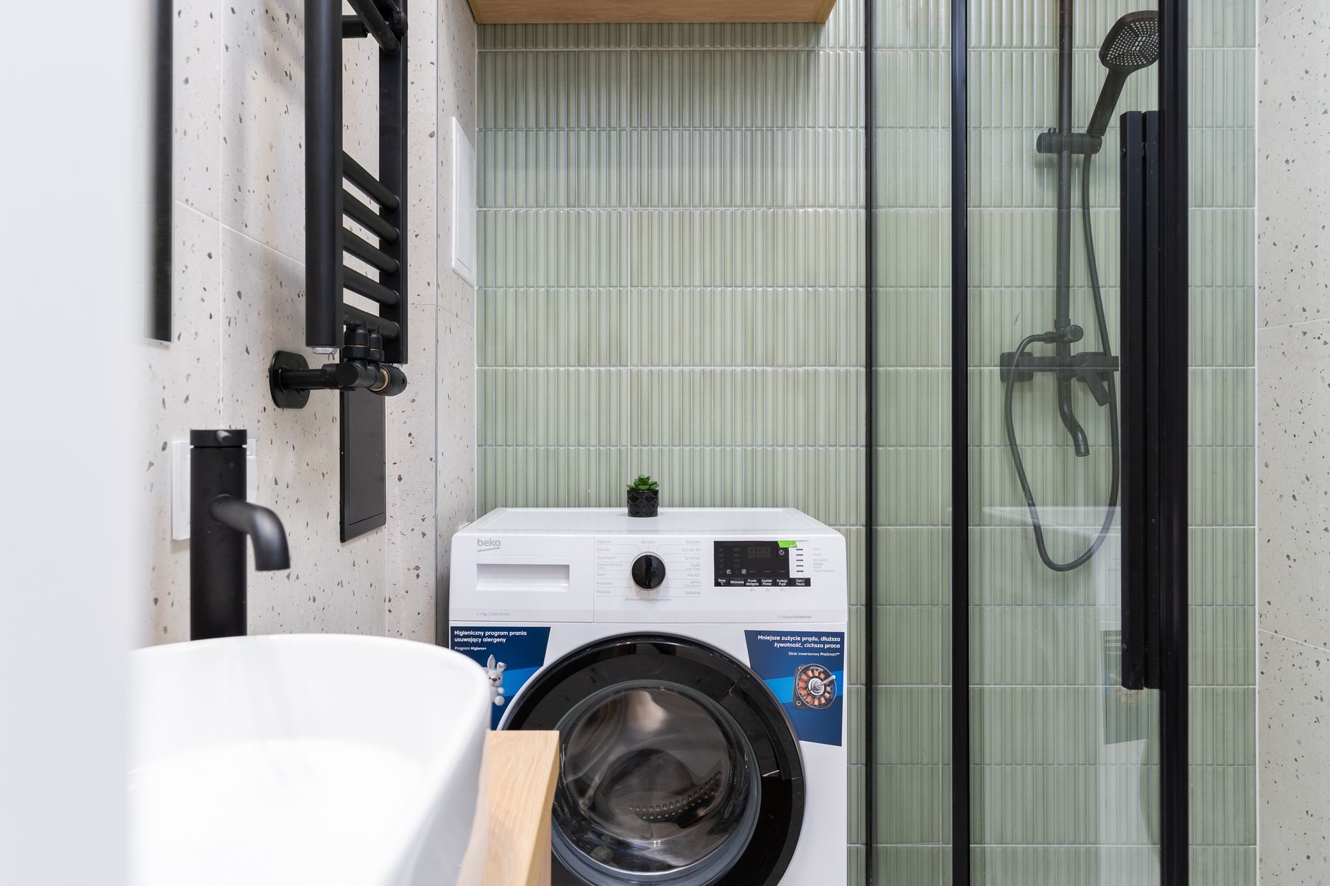 small functional laundry room with shelves