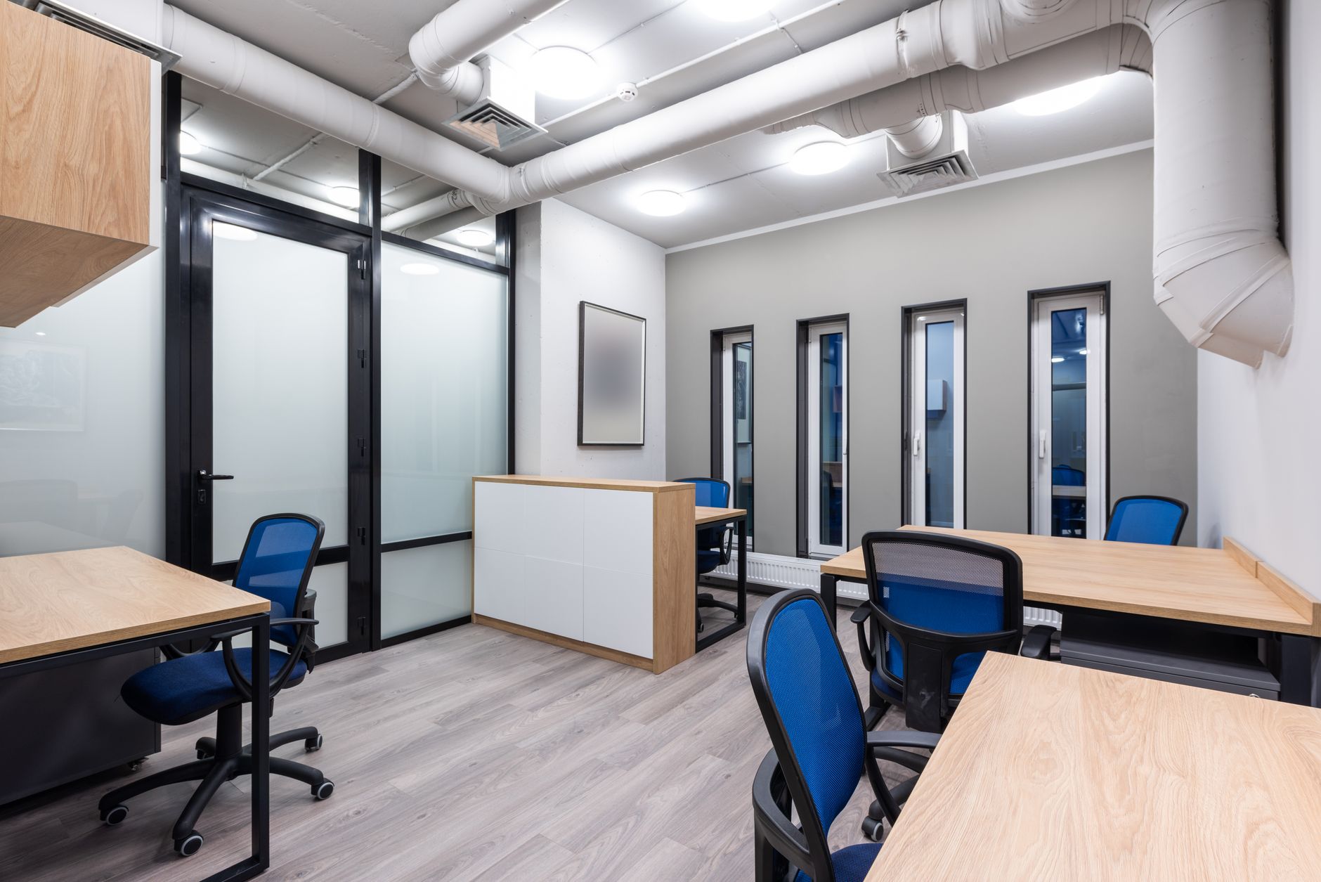 modern office furniture with wooden desk and metal chairs